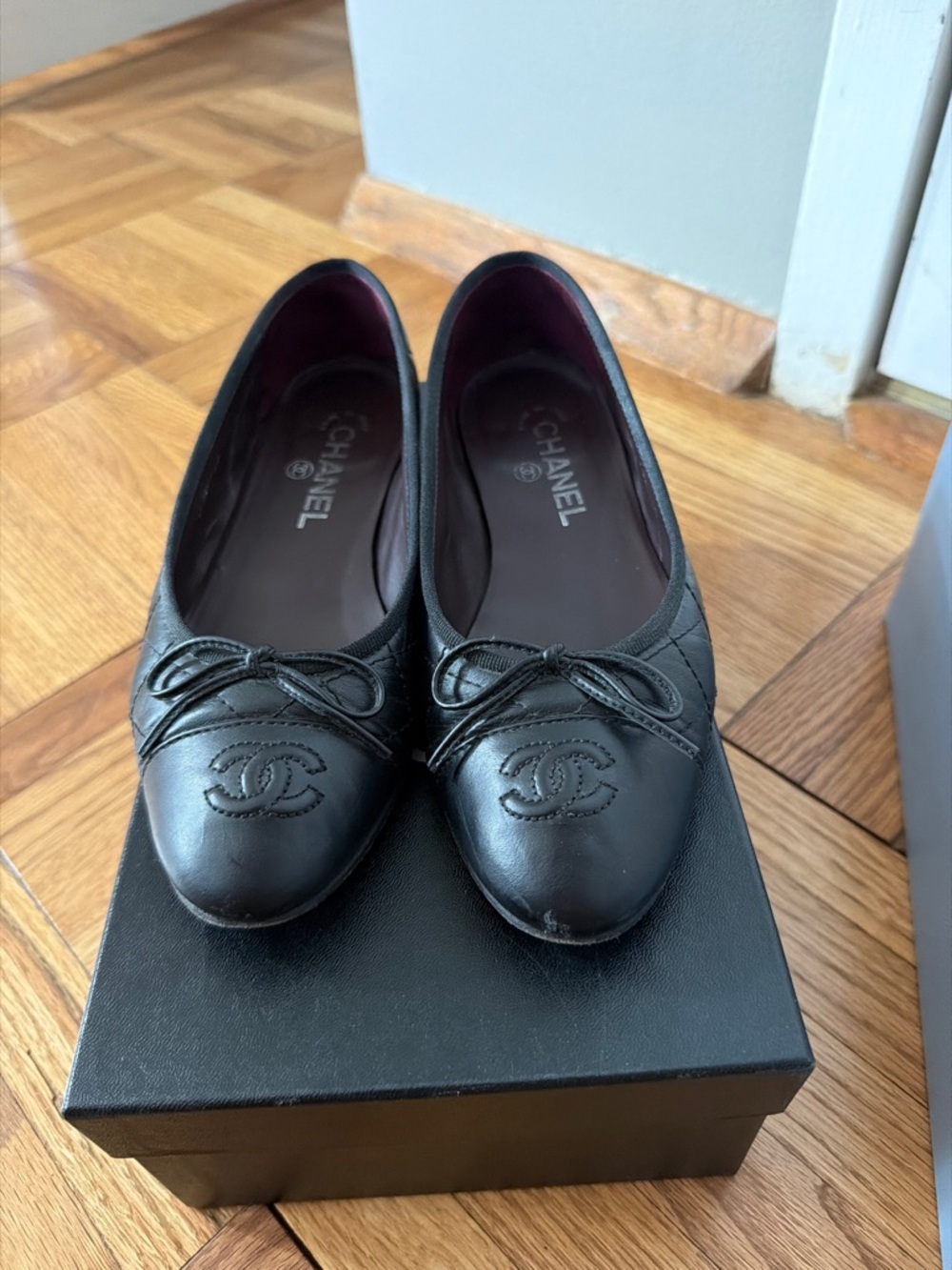 CHANEL Black Quilted Leather CC Logo Ballet Flats with Bow